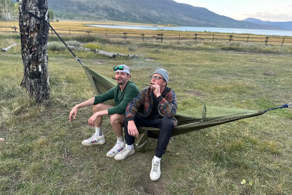 George and Lennie sitting on a Hammock at Fish Lake